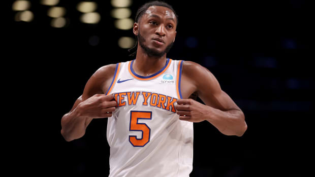 Immanuel Quickley reacts after a play against the Nets.